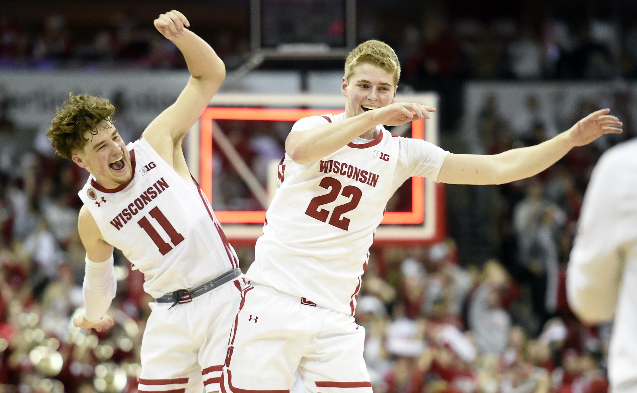 Wisconsin basketball; Badgers guard Max Klesmit celebrates with center Steven Crowl