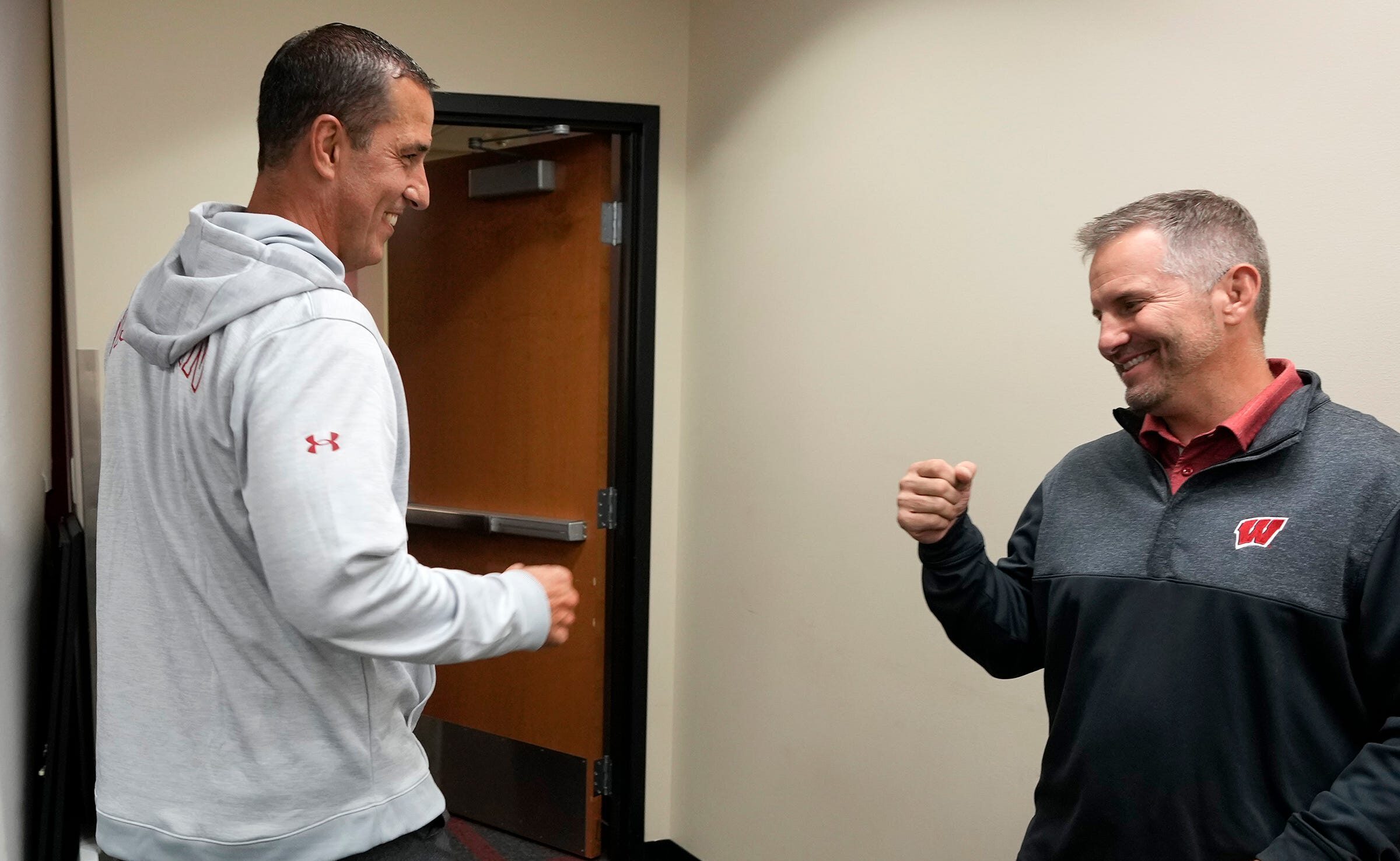 Wisconsin Badgers football coaches Luke Fickell and Mike Tressel