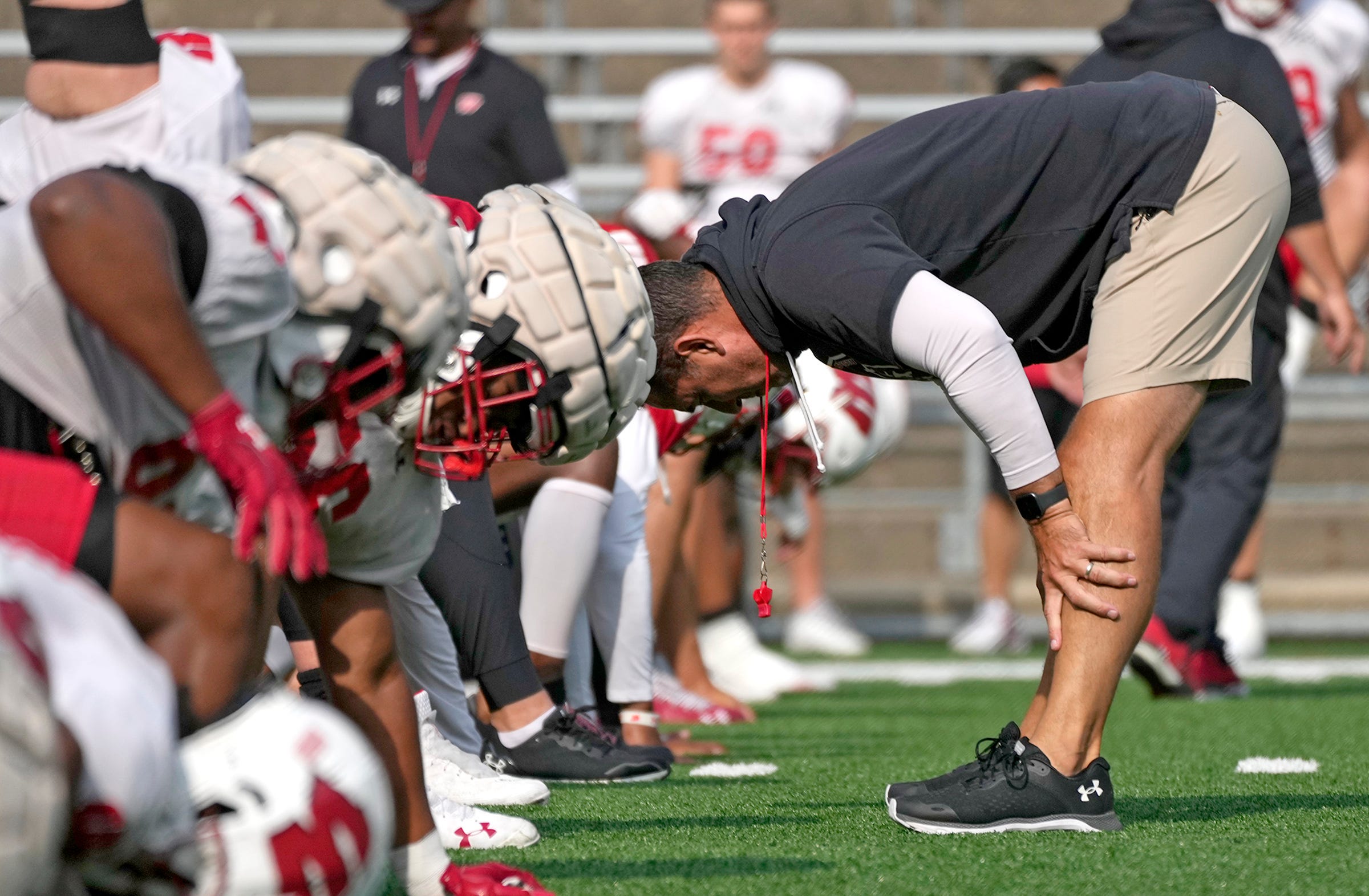 Wisconsin Badgers Football players stretching during fall camp