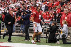 Wisconsin Badgers quarterback Tanner Mordecai exits the Iowa game with an injury