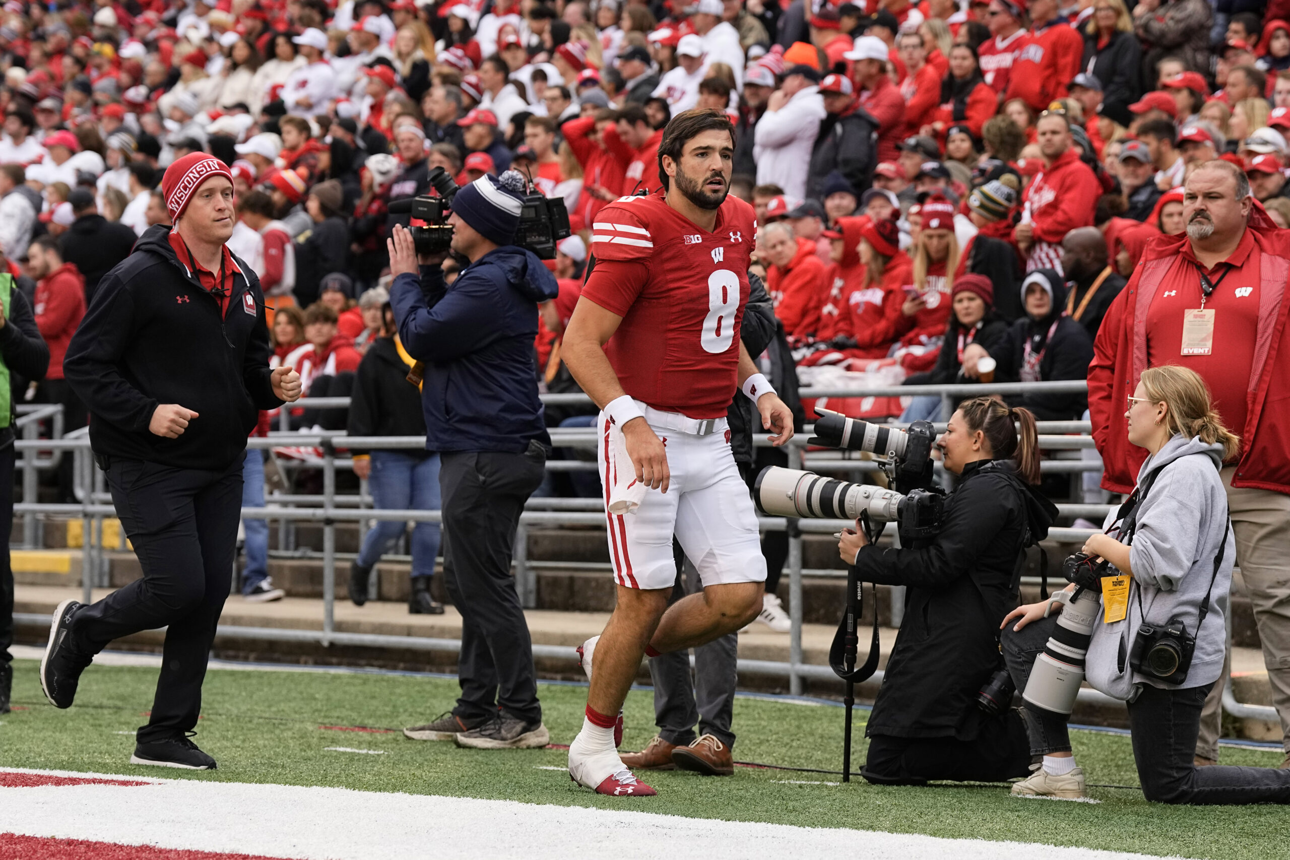 Wisconsin Badgers football quarterback Tanner Mordecai exits the Iowa game with an injury