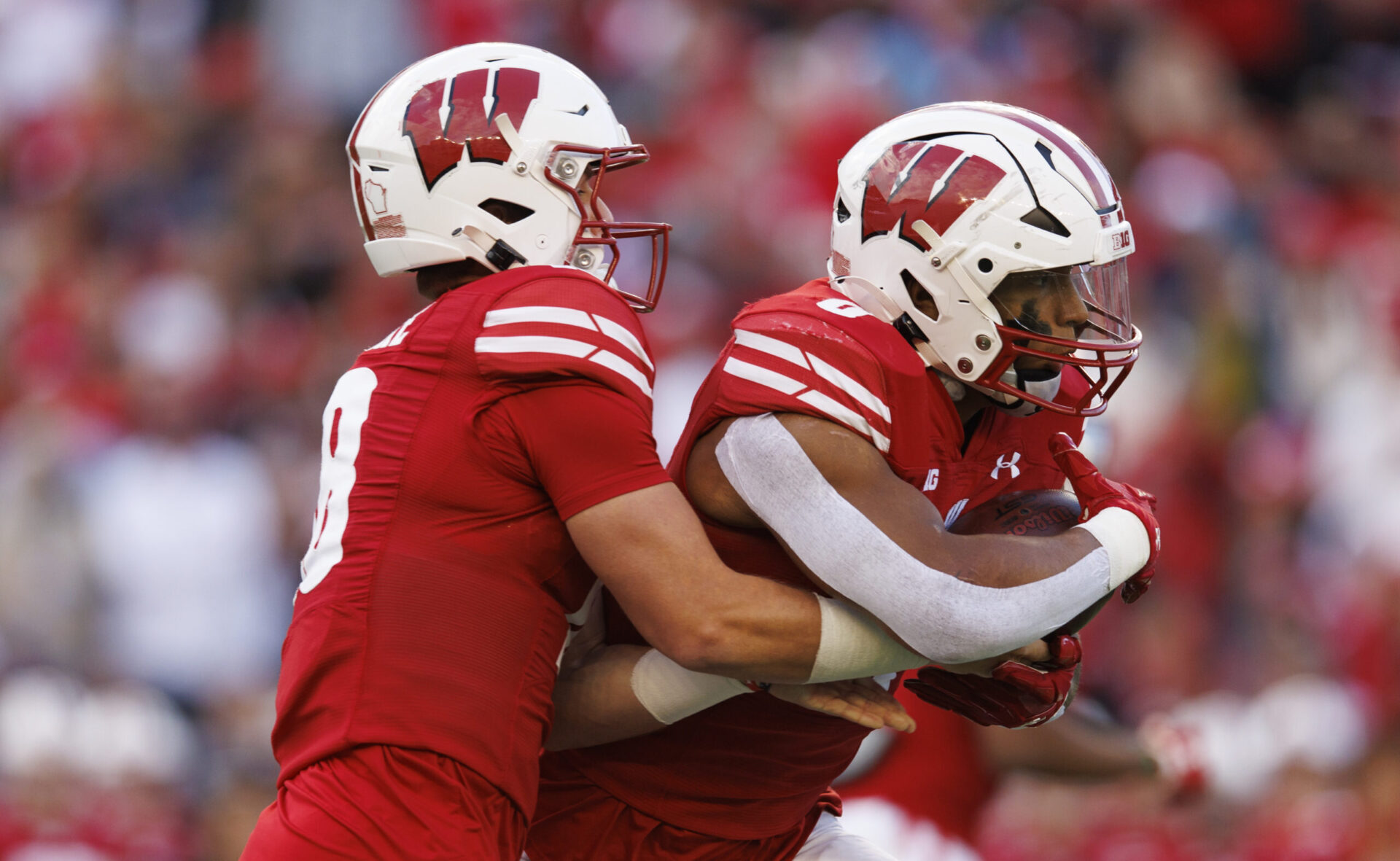 Wisconsin Badgers football quarterback Braedyn Locke and running back Braelon Allen vs. Iowa