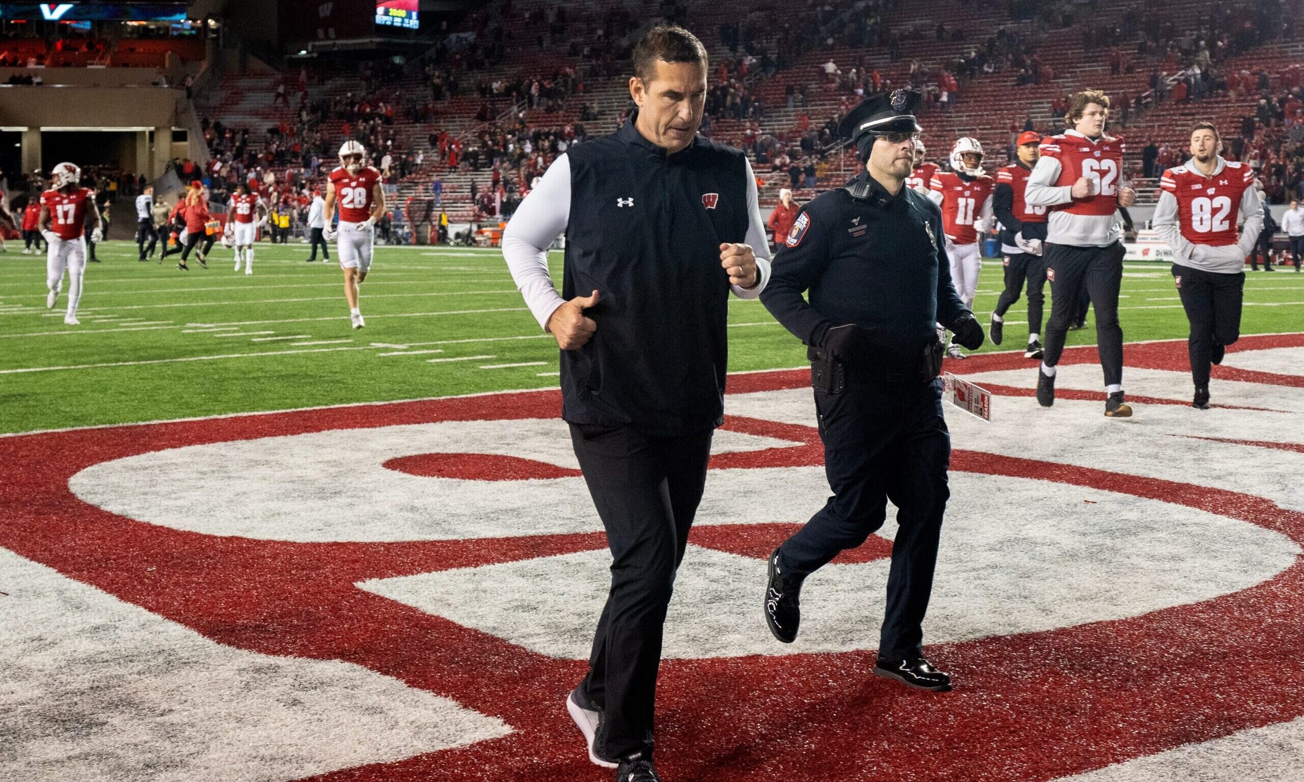 Wisconsin Badgers football head coach Luke Fickell runs off the field after a home loss to Northwestern
