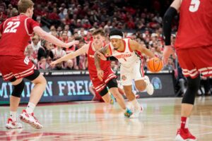 Roddy Gayle Jr. drives to the line while Wisconsin basketball guard Connor Essegian defends him