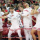 The Wisconsin Badgers bench celebrates after AJ Storr dunk.