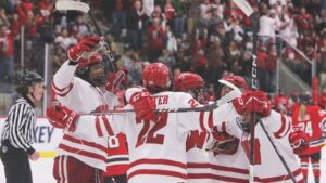 Wisconsin Badgers women's hockey players celebrate a goal in a victory to clinch a spot in the NCAA Tournament Frozen Four